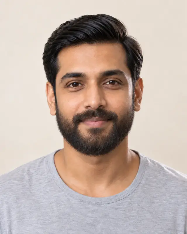 The same man with a full, rounded beard joined to a mustache